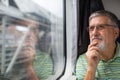 Senior man enjoying a train travel Royalty Free Stock Photo