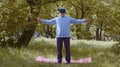 Senior man exercising, making dumbbell weight lifting exercises, wearing VR helmet play video game Royalty Free Stock Photo