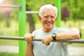Senior man exercising at outdoor gym Royalty Free Stock Photo