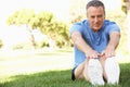 Senior Man Exercising In Park Royalty Free Stock Photo