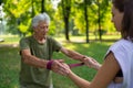 The senior man exercising in the park, using resistance band. Royalty Free Stock Photo