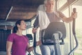 Senior man exercising on stationary bikes. Royalty Free Stock Photo