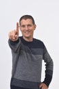 Senior man with finger in the shape of number Royalty Free Stock Photo