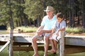 Senior man fishing with grandson Royalty Free Stock Photo