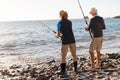 Senior man fishing with his grandson Royalty Free Stock Photo