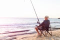 Senior man fishing at sea side Royalty Free Stock Photo