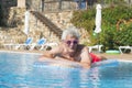 Senior man floating on water Royalty Free Stock Photo