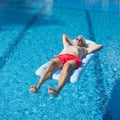 Senior man floating on water Royalty Free Stock Photo