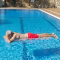 Senior man floating on water Royalty Free Stock Photo