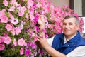 Senior man florist working in the garden Royalty Free Stock Photo