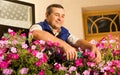 Senior man florist working in the garden Royalty Free Stock Photo