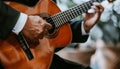 Senior man in formal attire playing acoustic guitar classic live music performance