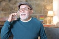 Senior man getting amazing news on the phone Royalty Free Stock Photo