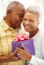 Senior man giving gift to wife Royalty Free Stock Photo
