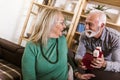 Senior man giving a present to his woman Royalty Free Stock Photo