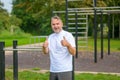 Senior man giving a thumbs up after working out in a park Royalty Free Stock Photo