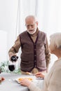 senior man in glasses pouring red Royalty Free Stock Photo