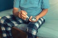 Senior man with glucometer checking blood sugar level