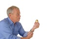 Senior man with golden egg Royalty Free Stock Photo