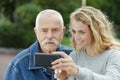 Senior man and granddaughter doing selfie Royalty Free Stock Photo
