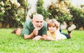 Senior man with grandson jogging in park. Cute child boy hugging his grandfather. Healthcare family lifestyle. Happy Royalty Free Stock Photo