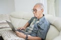 Senior man with gray hair using laptop computer Royalty Free Stock Photo