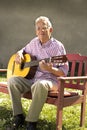 Senior man with guitar Royalty Free Stock Photo