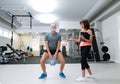 Senior man in gym working out with kettlebell Royalty Free Stock Photo