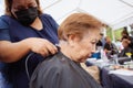 Senior man haircut with shaving machine.