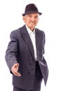 Senior man with hand outstretched for a handshake Royalty Free Stock Photo