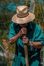 Senior man hand plowing in the field