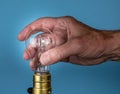 Senior man hand unscrewing the halogen bulb