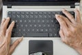 Senior man hands typing on the laptop computer Royalty Free Stock Photo