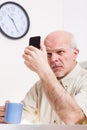 Senior man has problems with his vision Royalty Free Stock Photo