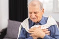 Senior man have a heart attack. Senior man is having pain in his chest Royalty Free Stock Photo