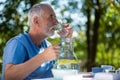 Senior man having breakfast in garden Royalty Free Stock Photo