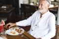 Senior man having breakfast at a hotel Royalty Free Stock Photo