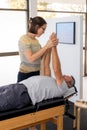 Senior man having chiropractic adjustment.