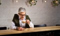 Senior man having a coffee in the bar Royalty Free Stock Photo