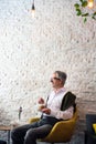 Senior man having a coffee in the bar Royalty Free Stock Photo