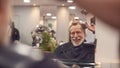 Senior Man Having Hair Cut By Female Stylist In Hairdressing Salon Royalty Free Stock Photo