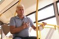Senior man having heart attack in  transport Royalty Free Stock Photo