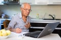 Senior man having online medical conversation Royalty Free Stock Photo