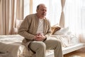 Senior man having stomach pain sitting at home. Royalty Free Stock Photo