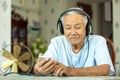 Senior man Headphones Listening Music at home Royalty Free Stock Photo