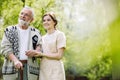 man with helpful volunteer in the garden of professional care home Royalty Free Stock Photo