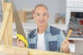 senior man holding hacksaw Royalty Free Stock Photo