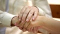 Senior man holding hand of young woman, support and care of relative concept Royalty Free Stock Photo