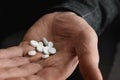 Senior man holding pills in his hand Royalty Free Stock Photo