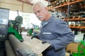 senior man holding sheet metal Royalty Free Stock Photo